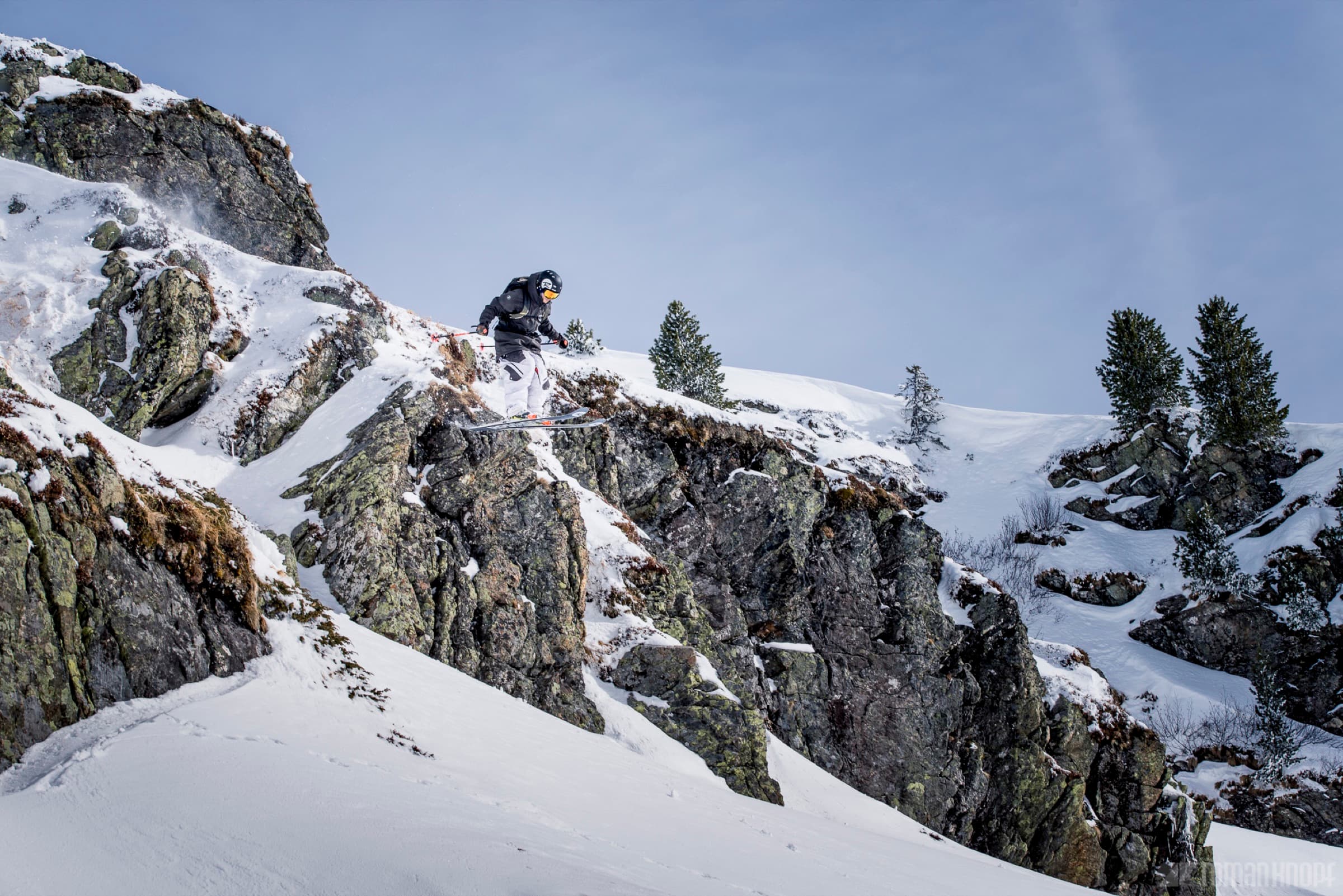 Backcountry skier dropping a cliff in Utah's Wasatch Mountains
