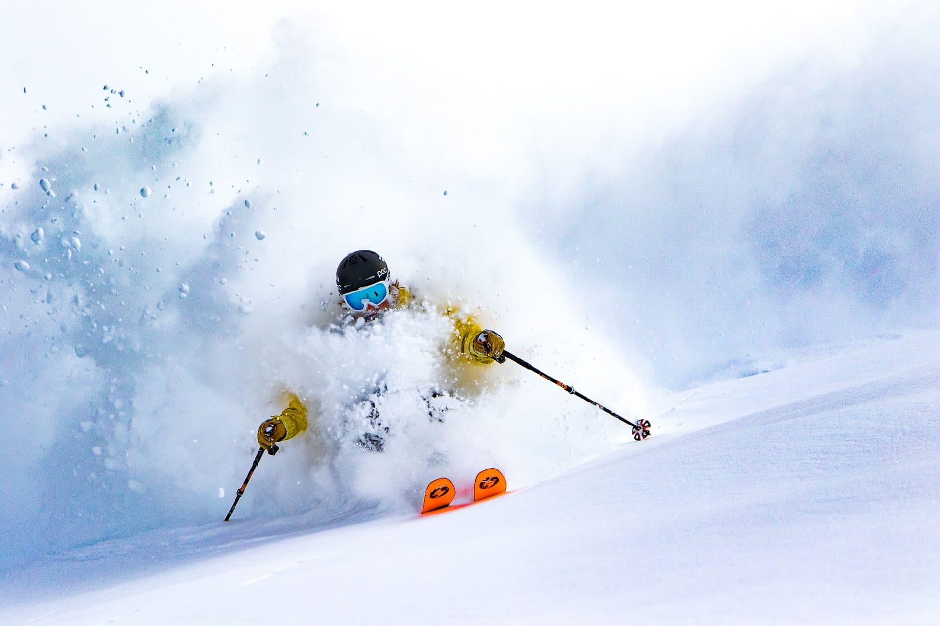 Skier slashing through deep Utah powder near Big Cottonwood Canyon